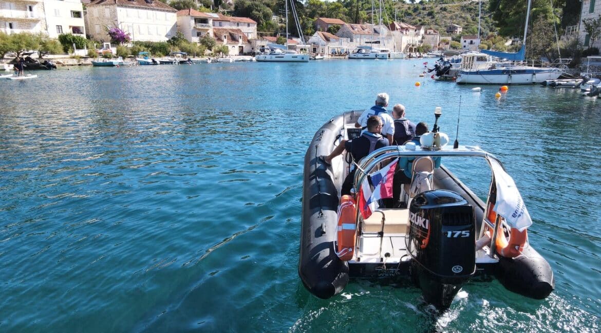 Power vs sail - A side-by-side comparison of a sailing yacht and a sleek powerboat in the Adriatic Sea.